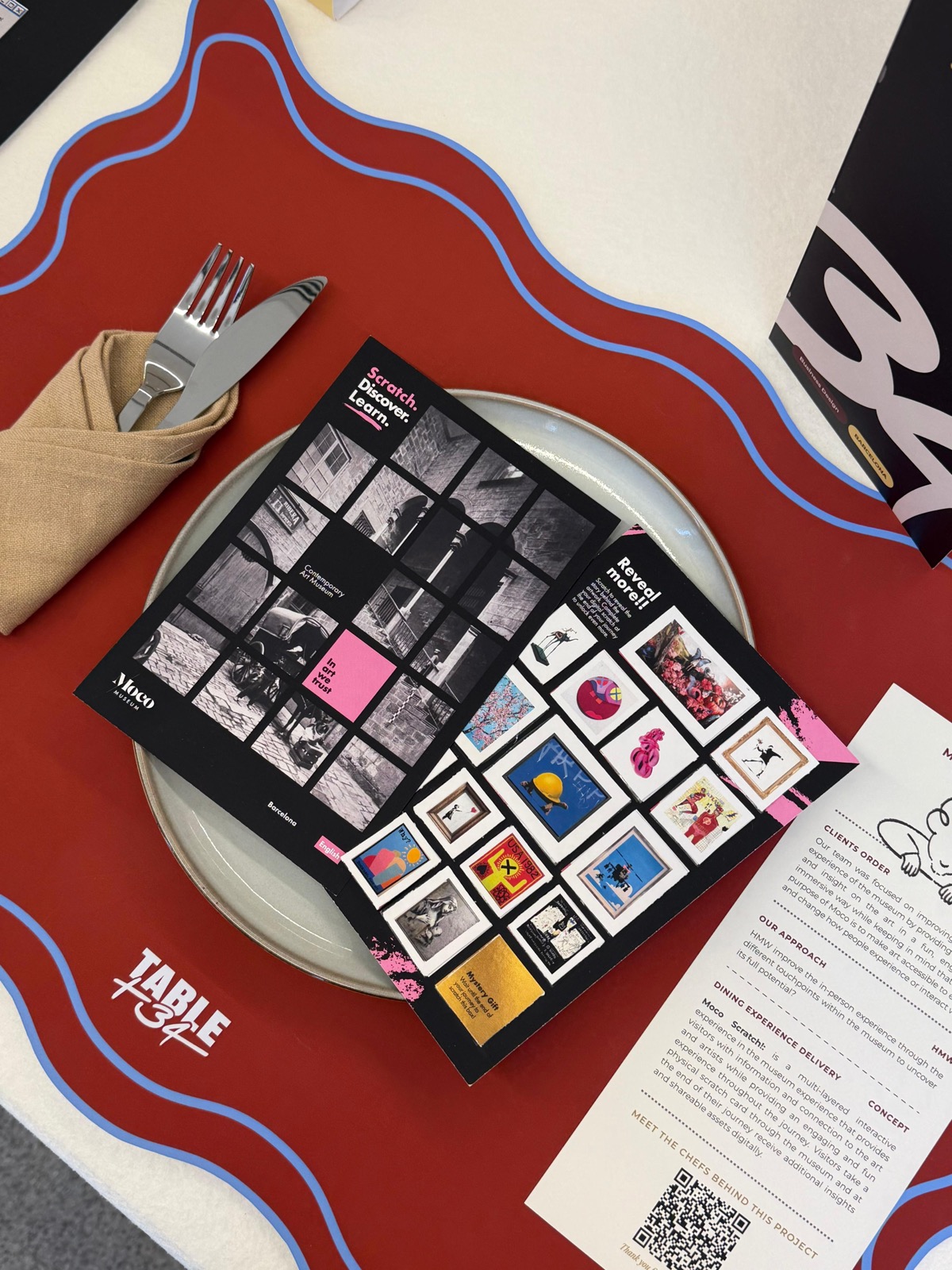 A project plated on a dinner plate, with a QR card to meet the chefs behind it