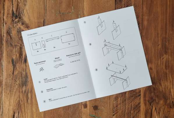 The printed self-assembly user manual for the table
