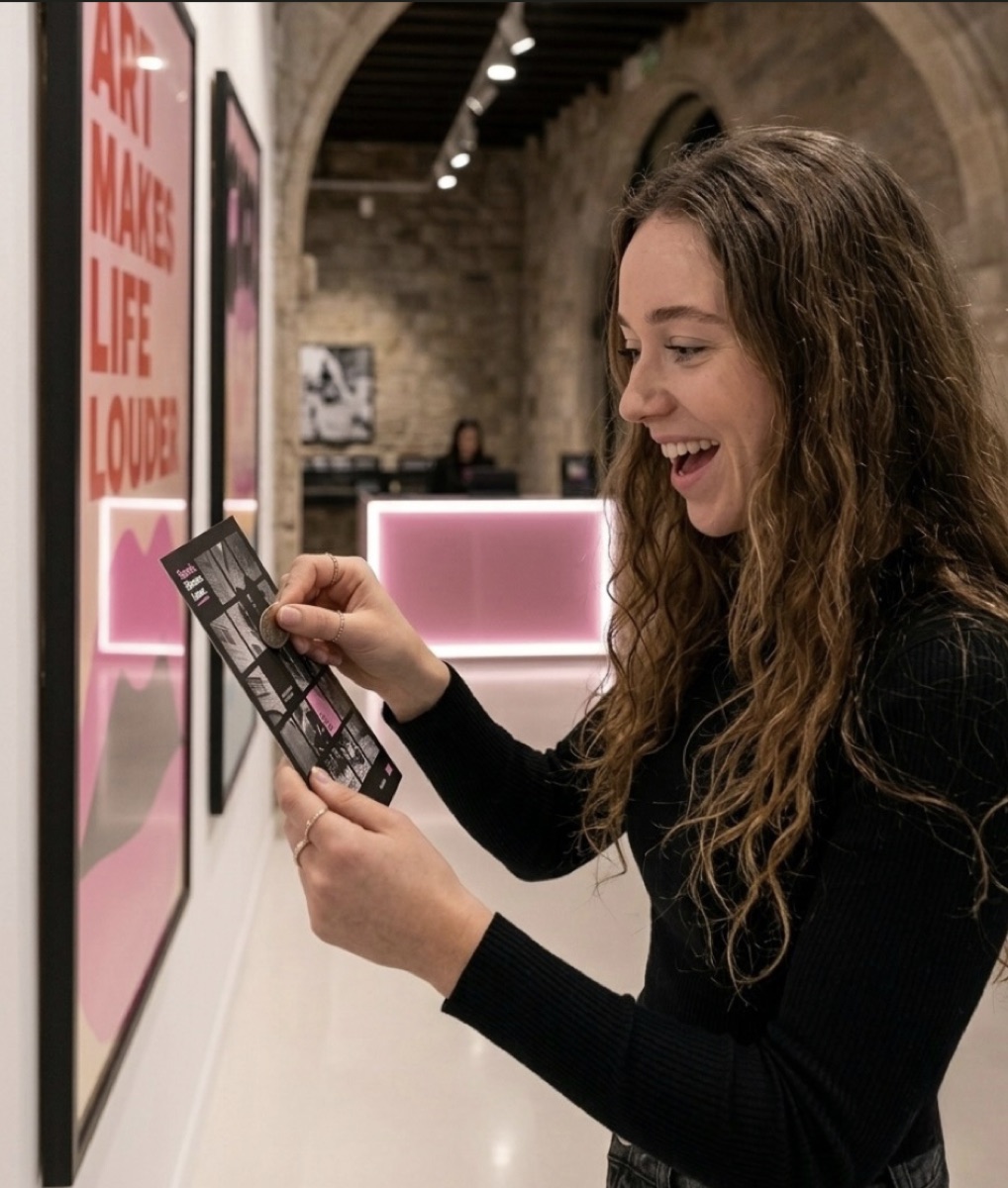 A visitor matches artworks on the scratch card while walking through the museum